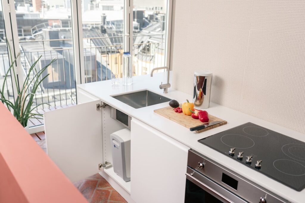 Compact kitchen counter and sink area showing the space constraints around a countertop dishwasher