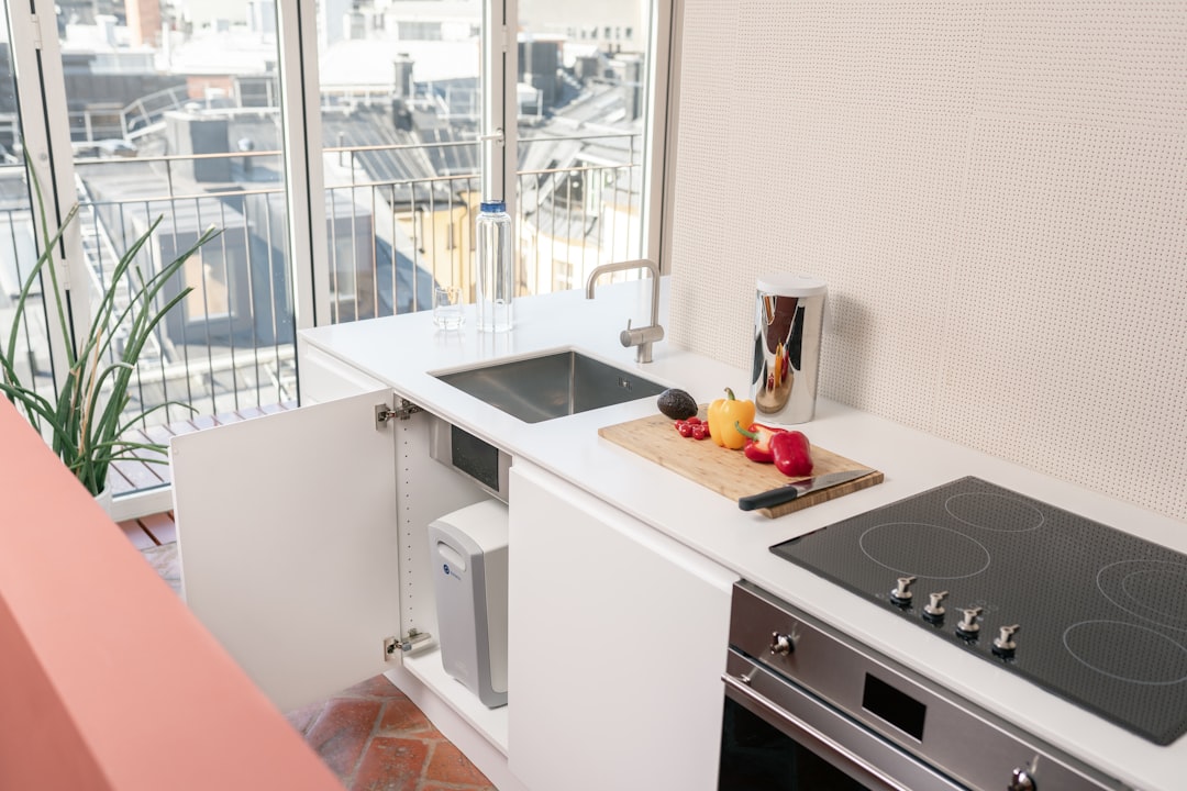 Compact kitchen counter and sink area showing the space constraints around a countertop dishwasher