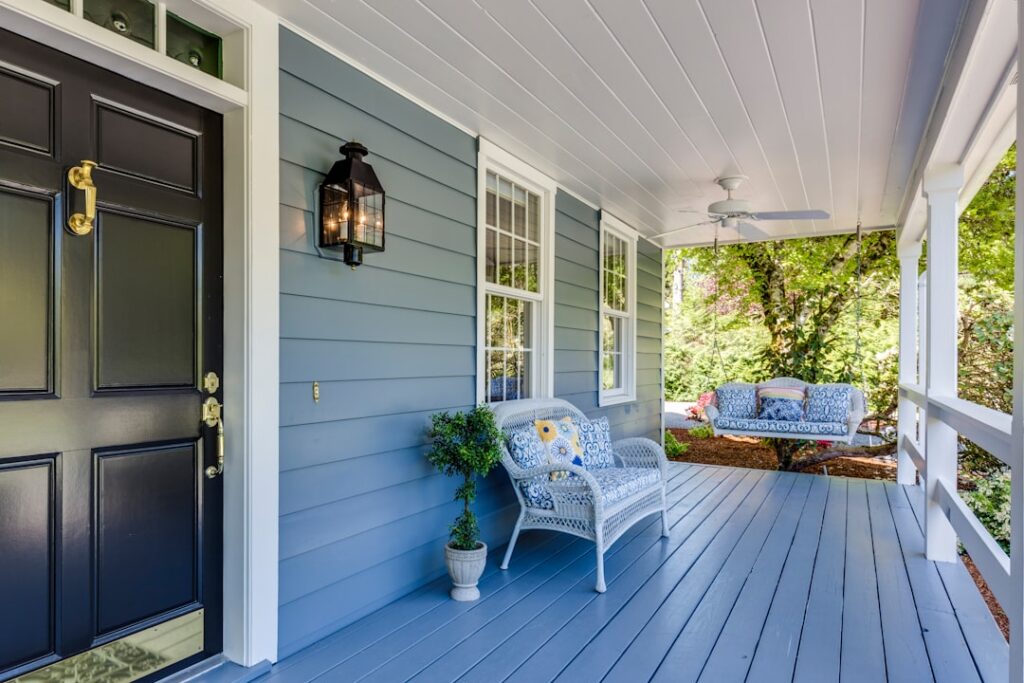 Residential front porch and entry door illustrating video doorbell coverage